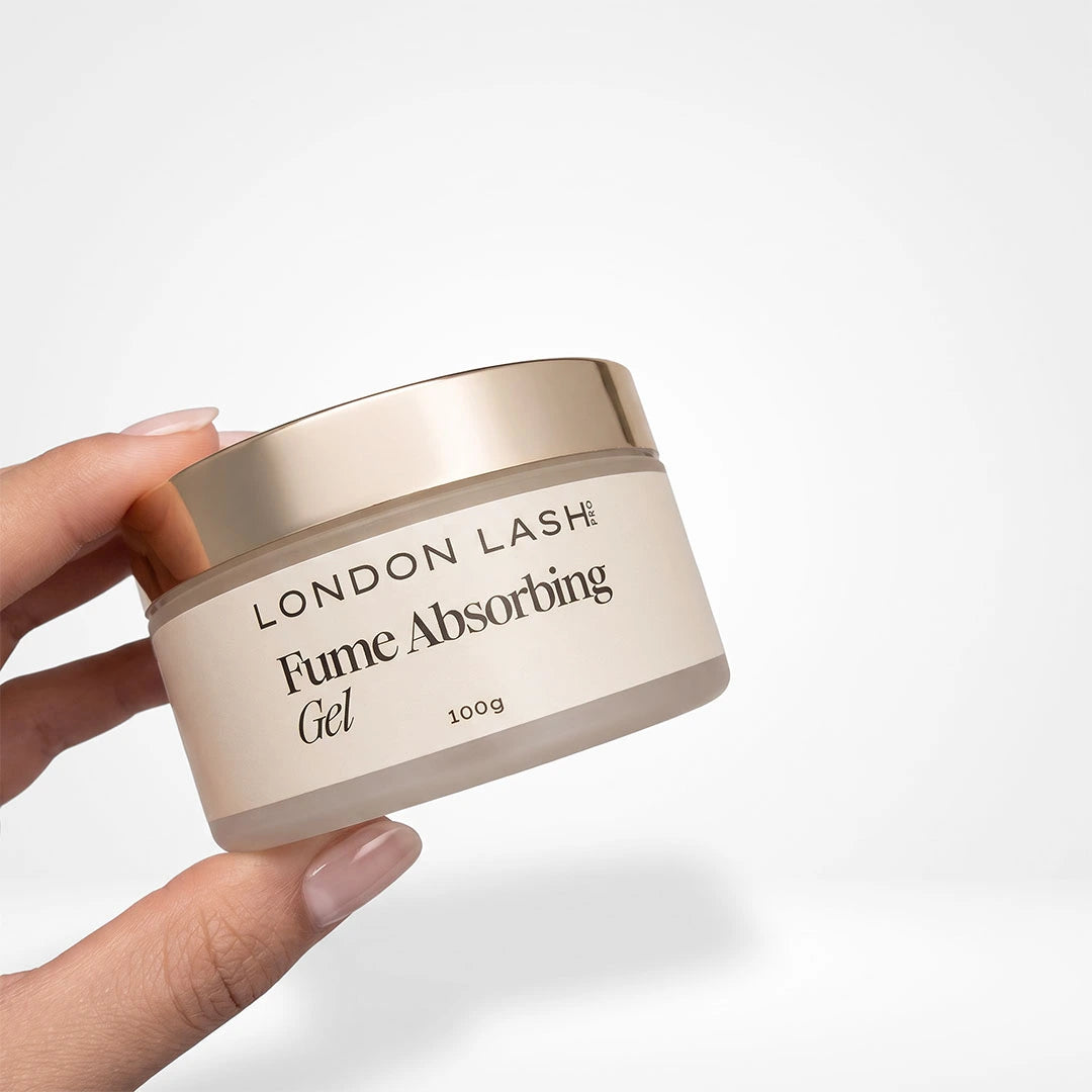 Lash tech holding a 100g jar of Fume Absorbing Gel by London Lash Pro