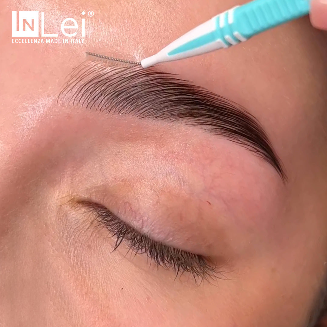 Eyebrow grooming with a blue and white tool, featuring the INLei brand.