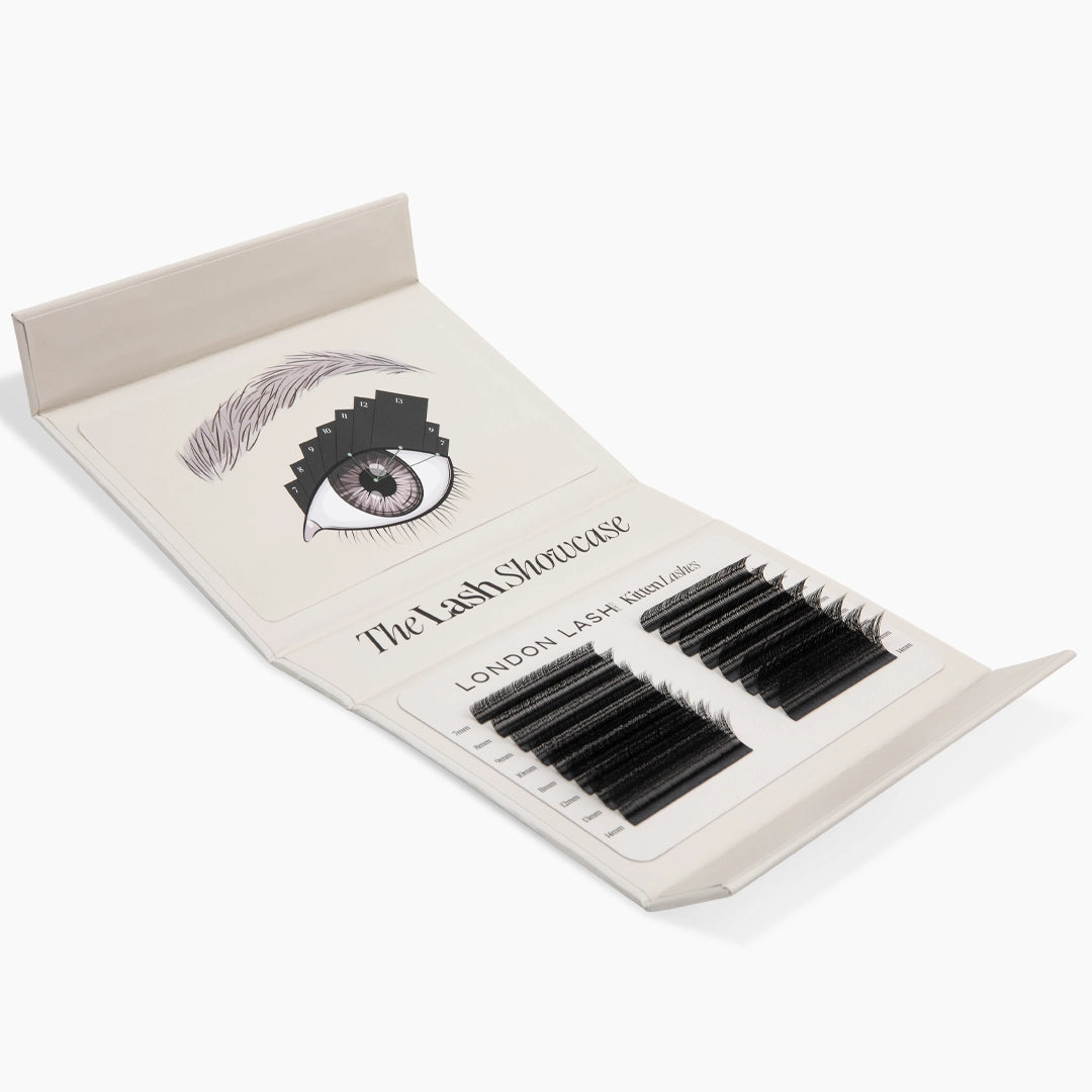 Open lash kit displaying an eye mapping guide alongside two trays of black Kitten Lash extension strips