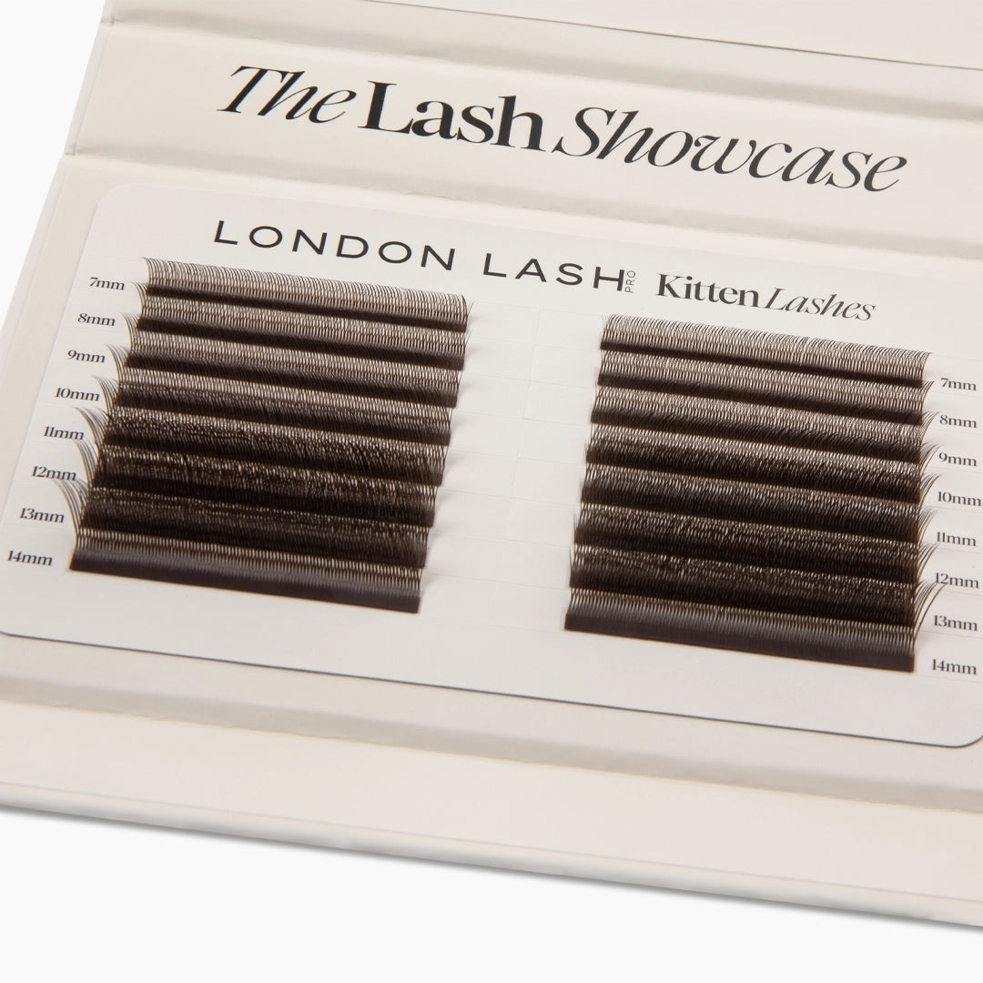 Overhead close-up of two neat columns of brown Kitten Lash extension strips labelled from 7mm to 14mm.