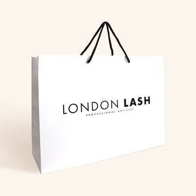 Paper Bag Containing Eyelash Extensions Kit
